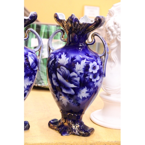 53 - A PAIR OF VICTORIAN BLUE AND WHITE HANDPAINTED TWIN HANDLED VASES, MARKED ROUEN TO THE BASE, HEIGHT ... 