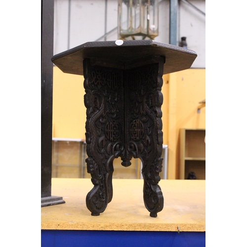 59 - A SMALL ORIENTAL HARDWOOD TABLE WITH CARVED ORIENTAL DECORATION, HEIGHT 44CM