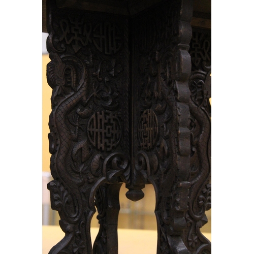 59 - A SMALL ORIENTAL HARDWOOD TABLE WITH CARVED ORIENTAL DECORATION, HEIGHT 44CM