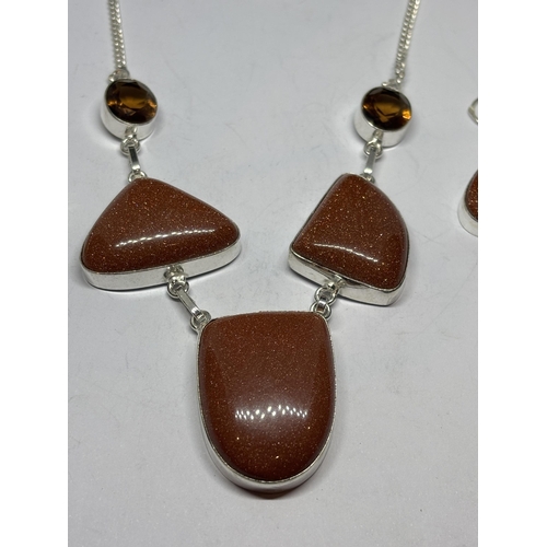 701 - A MARKED 925 SILVER GOLDSTONE NECKLACE AND EARRING SET