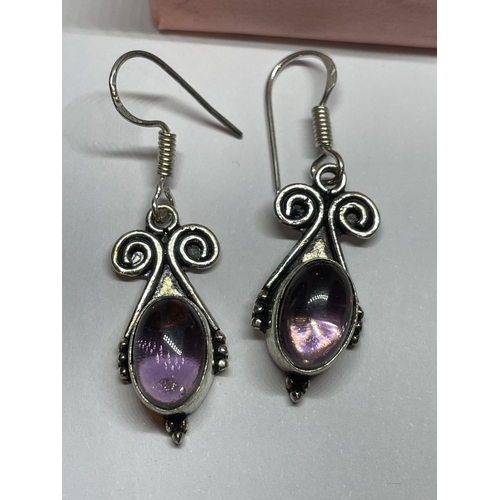 704 - A PAIR OF MARKED 925 SILVER AND AMETHYST STONE DROP EARRINGS IN A PRESENTATION BOX