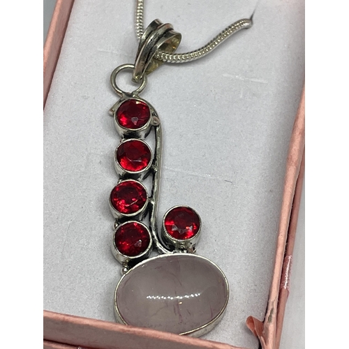 726 - A MARKED 925 SILVER NECKLACE WITH A ROSE QUARTZ AND RED STONE PENDANT IN A PRESENTATION BOX