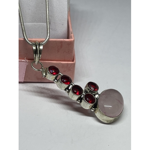 726 - A MARKED 925 SILVER NECKLACE WITH A ROSE QUARTZ AND RED STONE PENDANT IN A PRESENTATION BOX