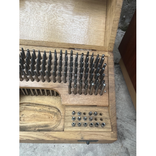 1502 - A VINTAGE ESSER SWITZERLAND WATCHMAKERS JEWELING TOOL SET WITH OAK STORAGE BOX