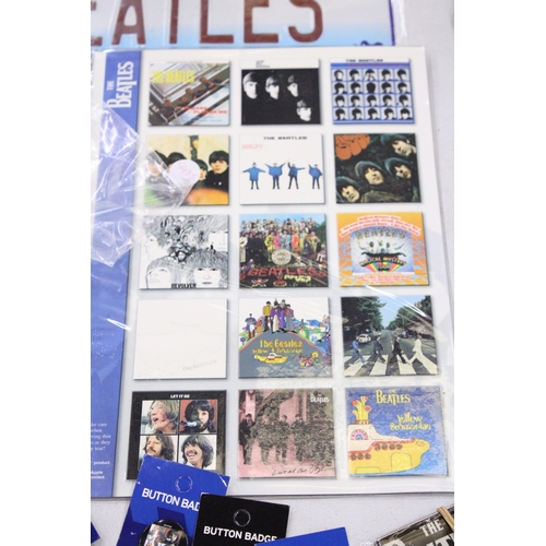 195 - A COLLECTION OF BEATLES ITEMS TO INCLUDE TINS, A TAXI CAR, STICKERS, MAGNETS, BADGES, ETC