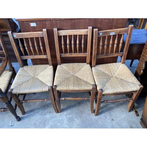 2719 - THREE BEECH RUSH SEATED DINING CHAIRS AND THREE VARIOUS CARVER CHAIRS