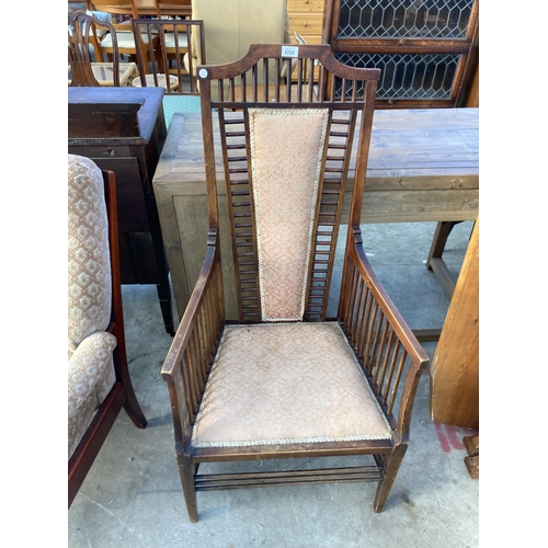 2722 - A HIGH BACK UPHOLSTERED ARMCHAIR IN THE RENNIE MACKINTOCH STYLE WITH TALL BACK AND MULTIPLE SPINDLES