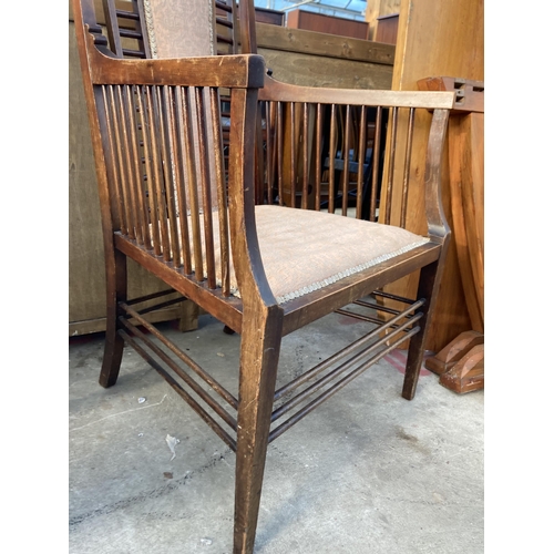 2722 - A HIGH BACK UPHOLSTERED ARMCHAIR IN THE RENNIE MACKINTOCH STYLE WITH TALL BACK AND MULTIPLE SPINDLES