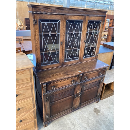 2724 - AN OAK DRESSER WITH GLAZED AND LEADED UPPER PORTION WITH CUPBOARDS AND DRAWERS TO BASE, 48