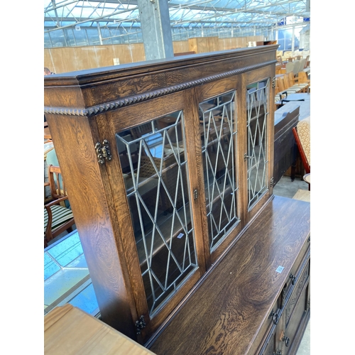 2724 - AN OAK DRESSER WITH GLAZED AND LEADED UPPER PORTION WITH CUPBOARDS AND DRAWERS TO BASE, 48