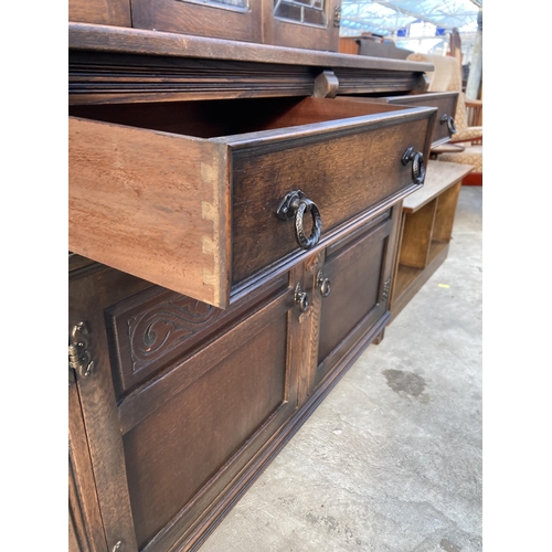 2724 - AN OAK DRESSER WITH GLAZED AND LEADED UPPER PORTION WITH CUPBOARDS AND DRAWERS TO BASE, 48