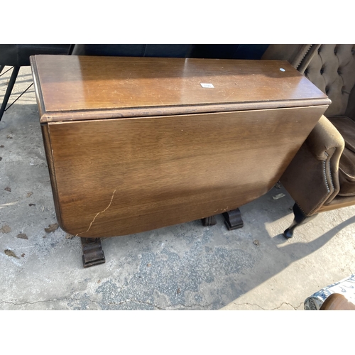 2743 - A MID 20TH CENTURY OAK DROP LEAF TABLE