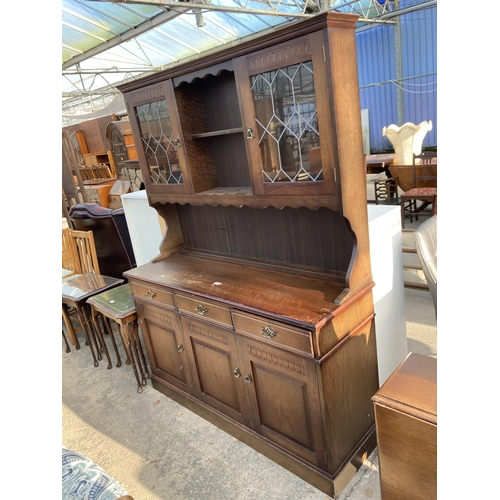 2744 - AN OAK DRESSER WITH GLAZED AND LEADED UPPER PORTION, 55