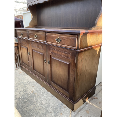 2744 - AN OAK DRESSER WITH GLAZED AND LEADED UPPER PORTION, 55