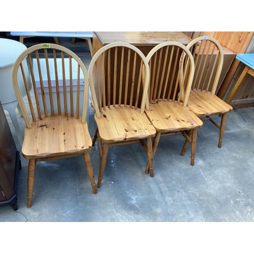 2802 - A SET OF FOUR PINE WINDSOR STYLE KITCHEN CHAIRS