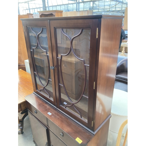 2803 - A MAHOGANY AND INLAID STRONGBOW FURNITURE TWO DOOR BOOKCASE ON BASE, 36