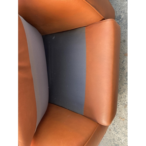 2807 - A BROWN LEATHER EASY CHAIR