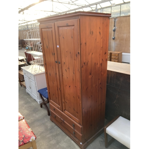 2858 - A PINE TWO DOOR WARDROBE WITH TWO DRAWERS TO BASE, 37