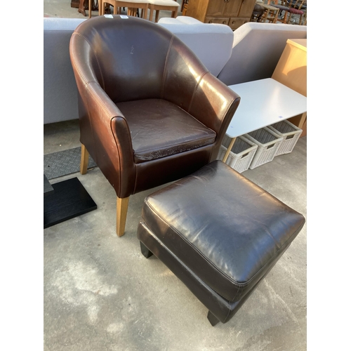 2879 - A BROWN FAUX LEATHER TUB CHAIR AND SIMILAR STOOL