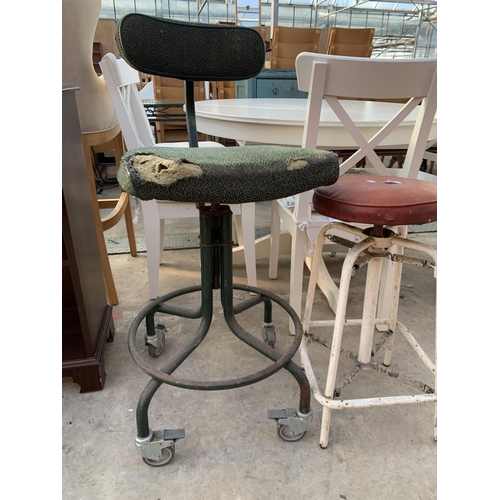 2538 - AN INDUSTRIAL STYLE SPRUNG STOOL AND REVOLVING CHAIR ON TUBULAR FRAME