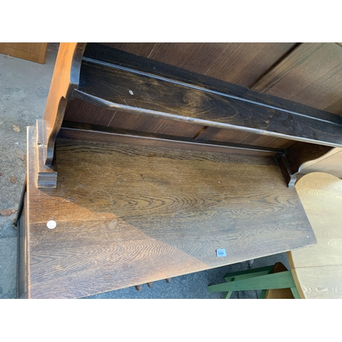 2566 - AN OAK JACOBEAN STYLE DRESSER WITH PLATE RACK, 42