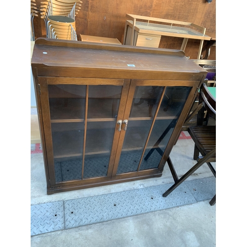 2598 - A MID 20TH CENTURY OAK TWO DOOR GLAZED BOOKCASE, 36