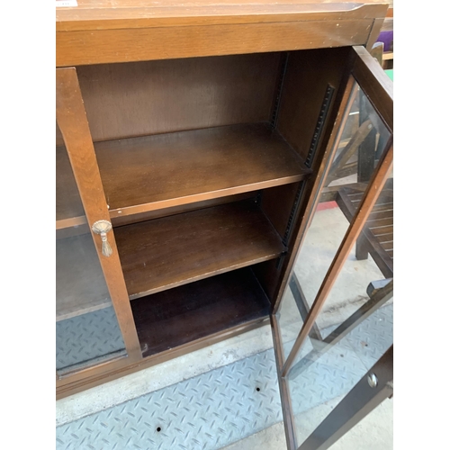 2598 - A MID 20TH CENTURY OAK TWO DOOR GLAZED BOOKCASE, 36