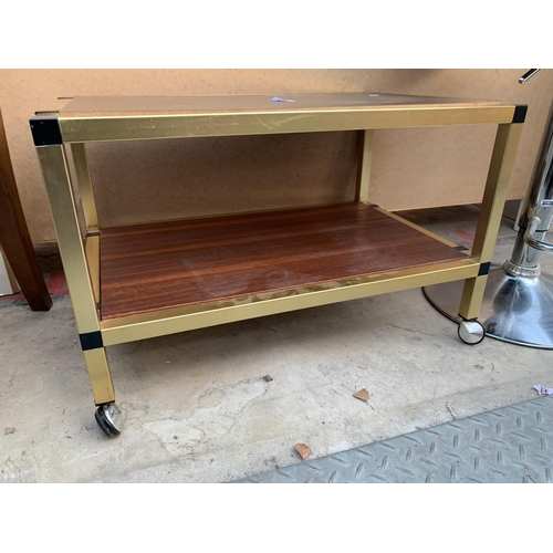 2604 - A METAL FRAMED TWO TIER COFFEE TABLE ON CASTORS