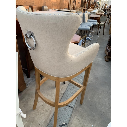 2606 - AN UPHOLSTERED RING BACK TALL STOOL