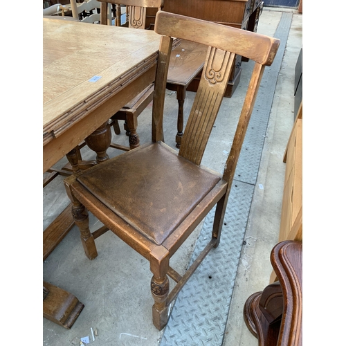 2615 - A MID 20TH CENTURY OAK DRAW LEAF DINING TABLE AND FOUR CHAIRS