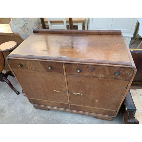 2621 - AN ART DECO SIDEBOARD WITH RAISED BACK, TWO DRAWERS AND TWO CUPBOARDS, 46