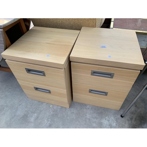 2628 - A PAIR OF OAK TWO DRAWER BEDSIDE CHESTS