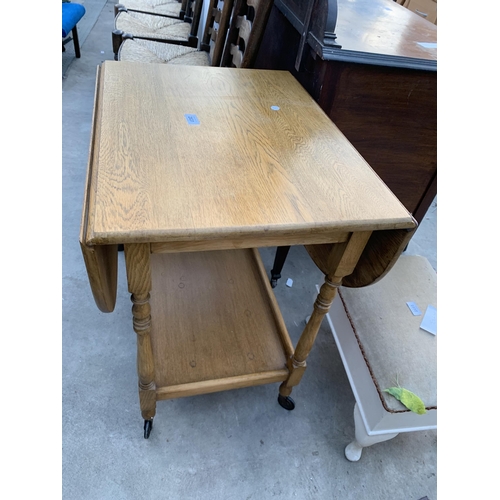 2631 - A MID 20TH CENTURY OAK TWO TIER DROP LEAF TROLLEY