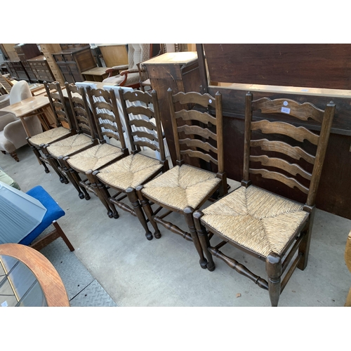 2632 - A SET OF SIX LANCASHIRE STYLE LADDER BACK DINING CHAIRS WITH RUSH SEATS