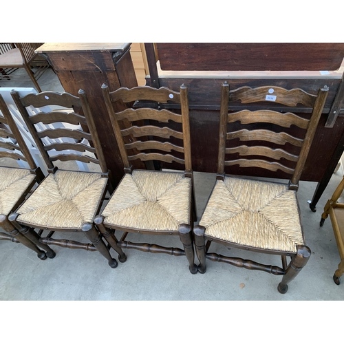 2632 - A SET OF SIX LANCASHIRE STYLE LADDER BACK DINING CHAIRS WITH RUSH SEATS