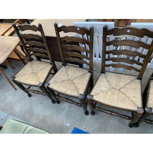 2632 - A SET OF SIX LANCASHIRE STYLE LADDER BACK DINING CHAIRS WITH RUSH SEATS