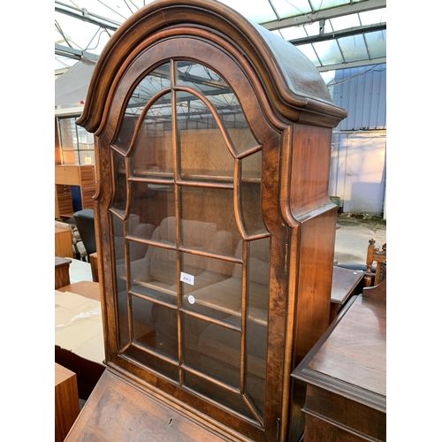 2663 - A QUEEN ANNE STYLE WALNUT AND CROSSBANDED BUREAU BOOKCASE WITH FITTED INTERIOR AND TWO DRAWERS ON CA... 