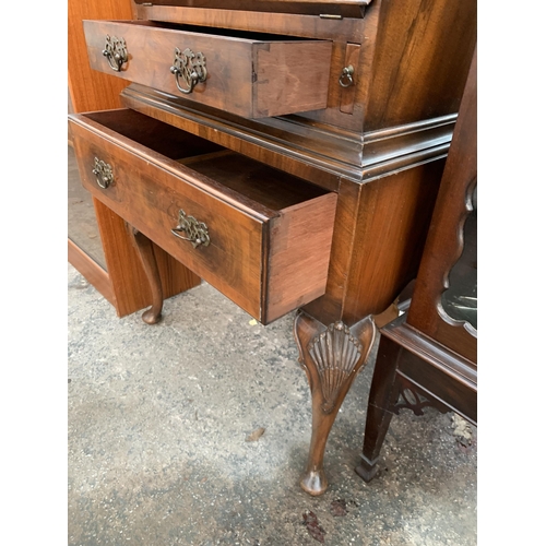 2663 - A QUEEN ANNE STYLE WALNUT AND CROSSBANDED BUREAU BOOKCASE WITH FITTED INTERIOR AND TWO DRAWERS ON CA... 