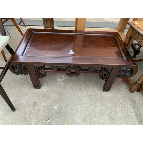 2671 - AN ORIENTAL HARDWOOD COFFEE TABLE WITH CARVED AND PIERCED FOLIATE FRIEZE AND SIDES, 35