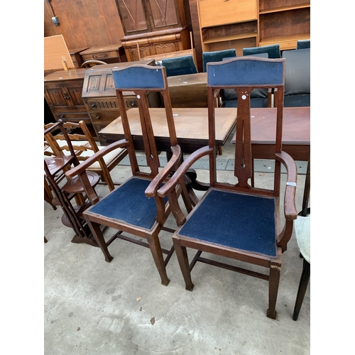 2673 - A PAIR OF OAK EARLY 20TH CENTURY HIGH BACK CARVER CHAIRS