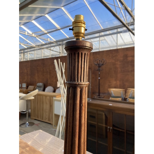 2686 - A MAHOGANY STANDARD LAMP WITH TURNED AND FLUTED COLUMN