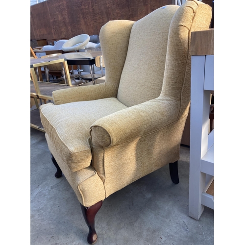 2688 - A MULTIYORK WINGED FIRESIDE CHAIR ON FRONT CABRIOLE LEGS