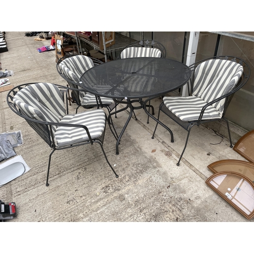 1530 - A LARGE METAL JOHN LEWIS CIRCULAR PATIO TABLE AND FOUR HEAVY METAL CHAIRS COMPLETE WITH CUSHIONS