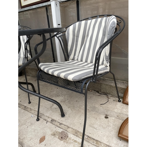 1530 - A LARGE METAL JOHN LEWIS CIRCULAR PATIO TABLE AND FOUR HEAVY METAL CHAIRS COMPLETE WITH CUSHIONS