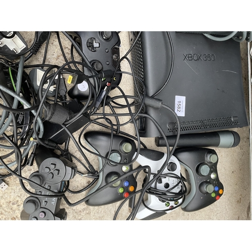 1582 - AN ASSORTMENT OF VARIOUS GAMES CONSOLE ITEMS TO INCLUDE AN XBOX, AN XBOX 360, CONTROLLERS AND GAMES ... 