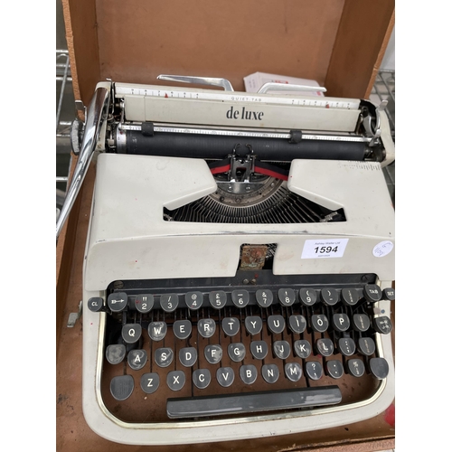 1594 - A DELUXE QUIET TAB TYPE WRITER WITH CARRY CASE