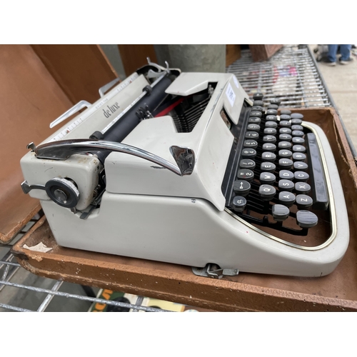 1594 - A DELUXE QUIET TAB TYPE WRITER WITH CARRY CASE