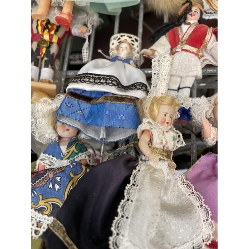 1596 - A LARGE ASSORTMENT OF VARIOUS VINTAGE DOLLS