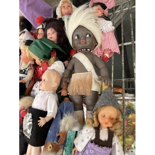 1604 - A LARGE ASSORTMENT OF VINTAGE DOLLS