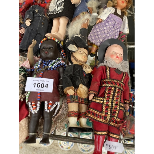 1604 - A LARGE ASSORTMENT OF VINTAGE DOLLS